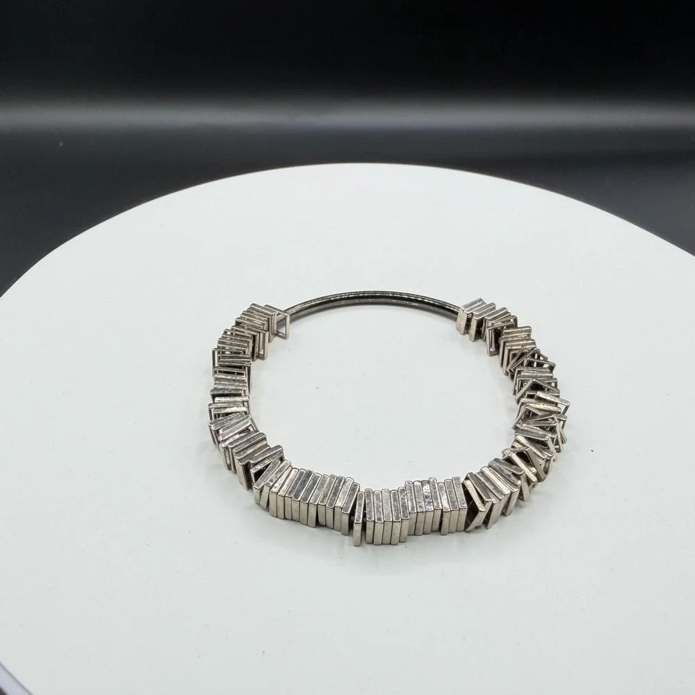 N/A sculptural silver